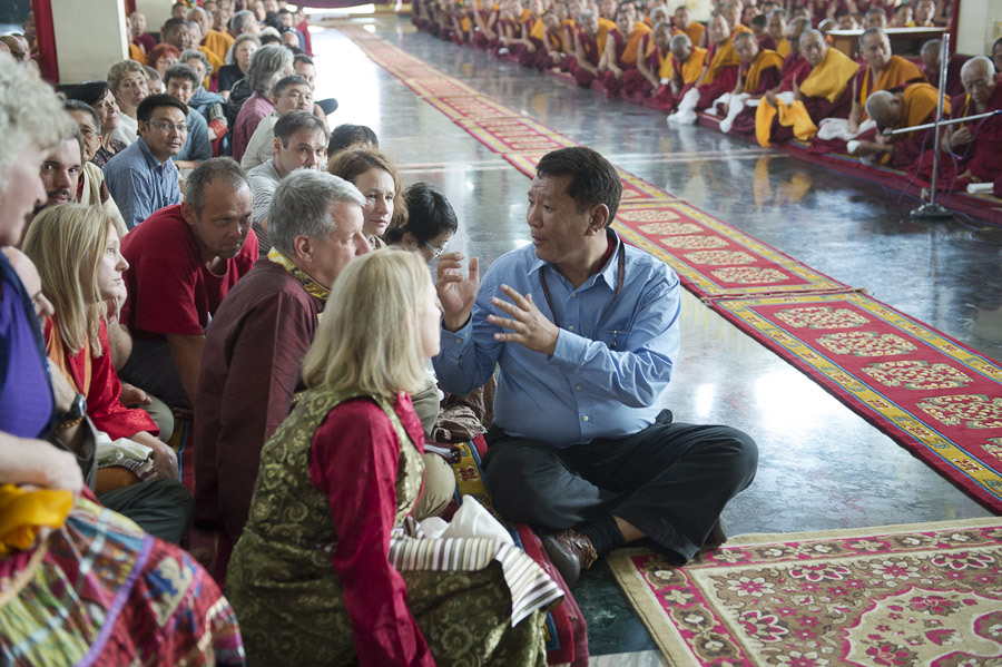 Supporters and guests listening to an English translation during His Holiness the Dalai Lama's visit to Drepung Gomang Monastery in Mundgod, Karnataka, India on December 29, 2014. Photo/Tenzin Choejor/OHHDL