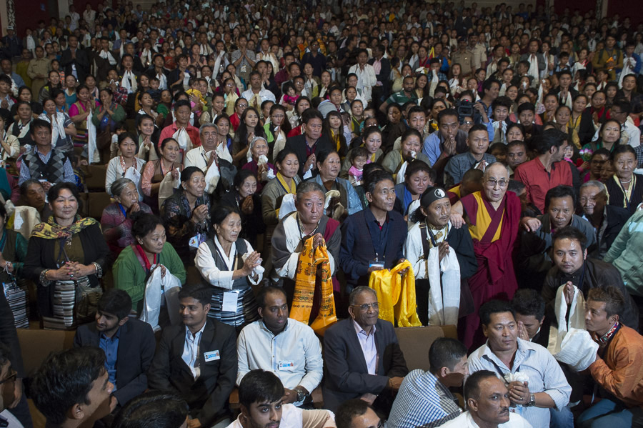 The audience on their feet at the start of the interactive session with His Holiness the Dalai Lama and students at Veer Narmad South Gujarat University's VNSGU Convention Center in Surat, Gujarat, India on January 1, 2015. Photo/Tenzin Choejor/OHHDL