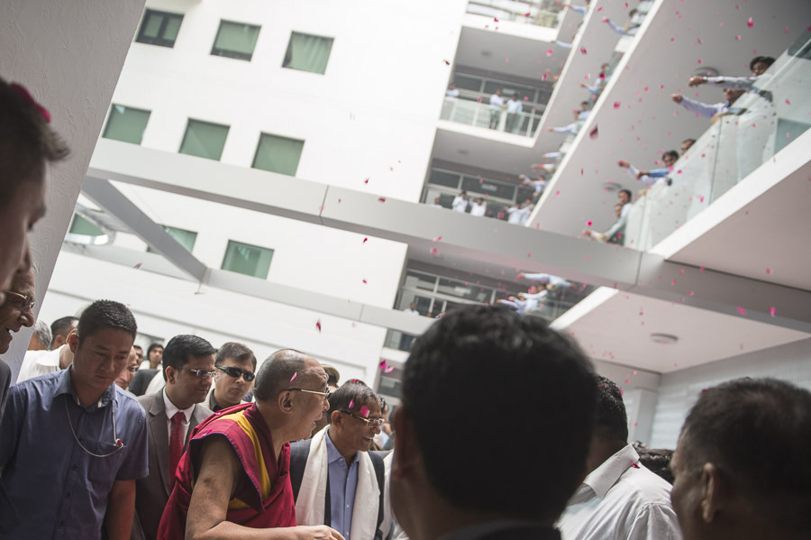 Staff at Shree Ramkrishna Exports (SRK) shower His Holiness the Dalai Lama with rose petals on his arrival at their offices in Surat, Gujarat, India on January 1, 2015. Photo/Tenzin Choejor/OHHDL
