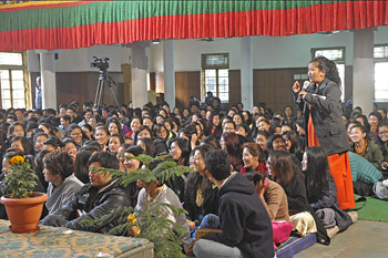 A member of the audience asking His Holiness the Dalai Lama a question during his talk to students and staff living at the Tibetan Youth Hostel in New Delhi, India on January 25, 2015. Photo/Tenzin Jamphel/OHHDL