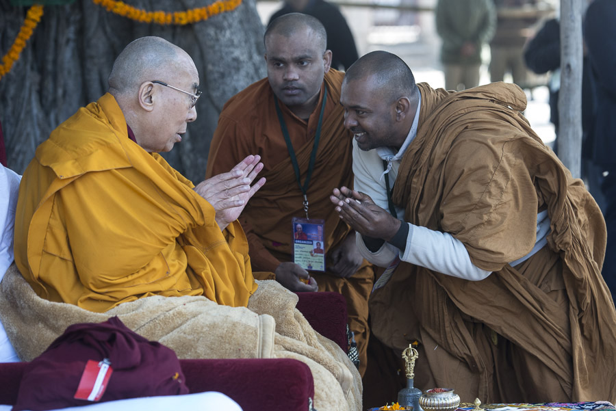 His Holiness the Dalai Lama speaking with local Indian Buddhist monks during the prayer offering in front of the stupa in Sankisa, UP, India on January 30, 2015. Photo/Tenzin Choejor/OHHDL