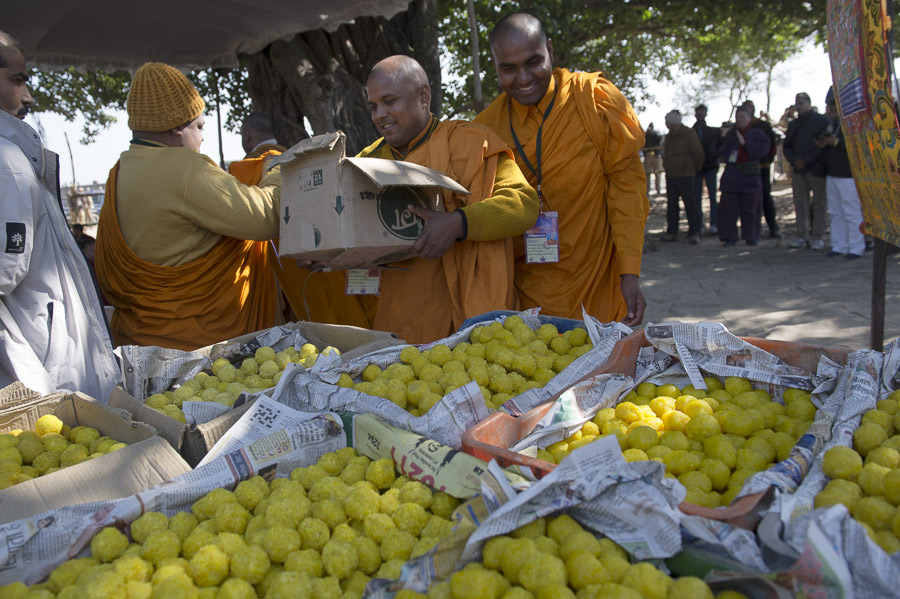 Local Indian monks preparing to distribute offerings to the gathered crowd during the prayer offering with His Holiness the Dalai Lama in Sankisa, UP, India on January 30, 2015. Photo/Tenzin Choejor/OHHDL