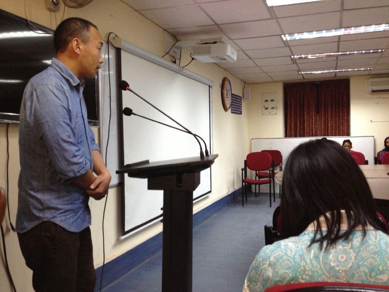 A Tibet Museum staff introducing the themes of the exhibition to the students and visitors.