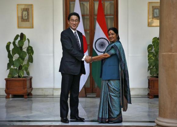 Japan's Foreign Minister Fumio Kishida (L) shakes hands with his Indian counterpart Sushma Swaraj before their meeting in New Delhi January 17, 2015. Credit: Reuters/Ahmad Masood