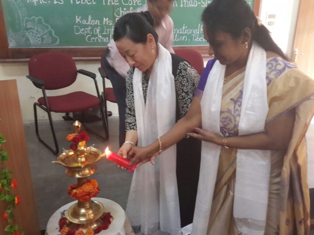 DIIR Kalon Ms. Dicki Chhoyang accompanied by Principal Ms. B. Madhumati, lighting the ceremonial lamp on her arrival at Sri Sarvajna college, 30 January 2015.