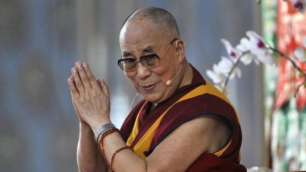 Exiled Tibetan spiritual leader, the Dalai Lama, gestures as he speaks to his followers during the Jangchup Lamrim teaching session at the Gaden Jangtse Thoesam Norling Monastery in Mundgod in the southern Indian state of Karnataka December 23, 2014. (Abhishek N. Chinnappa/REUTERS)