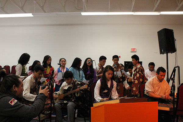 Students bof the Tibetan weekend school in Portland performing at DIIR Kalon's visit.