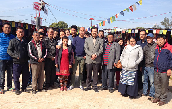 Health Kalon Dr. Tsering Wangchuk with Tibetan sweater sellers in Chandigarh.
