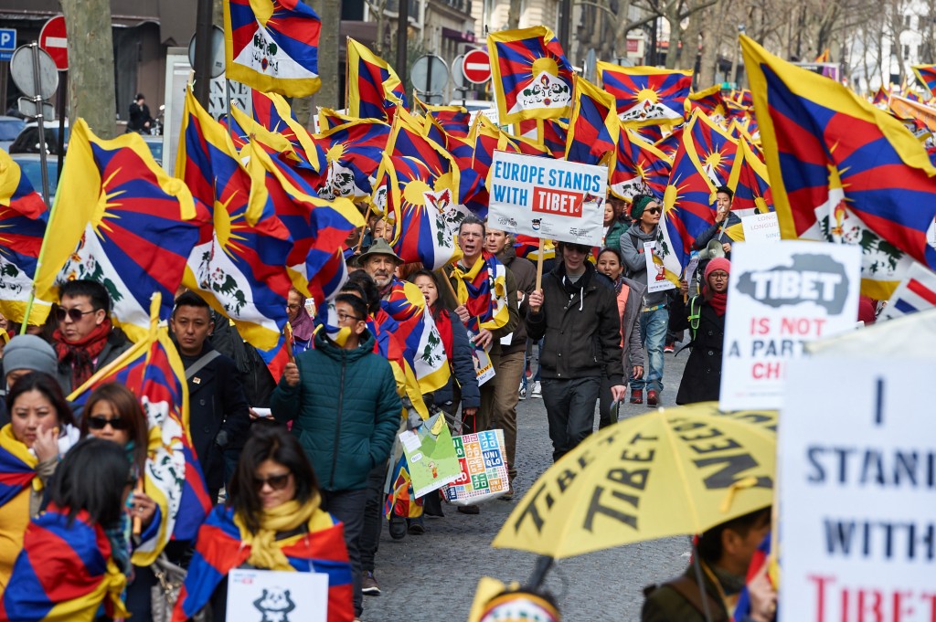 A flurry of Tibetan national flags fluttering at the Europe STands with tibet rally in Paris, 14 March 2015. Photo/ Olivier Adam