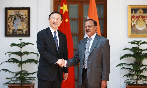 India’s National Security Adviser Ajit Kumar Doval, right, and Chinese State Councilor Yang Jiechi shake hands before the start of the 18th round of talks on India-China border dispute in New Delhi, India, Monday, March 23, 2015.