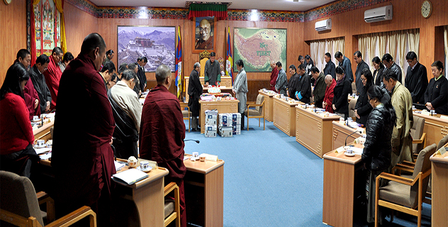 Members of the Tibetan Parliament observing a minute's silence as a mark of respect for the Tibetan self-immolators who lost their lives for the cause of Tibet.