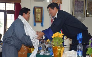 Sikyong Dr. Lobsang Sangay felicitating Dr. Jamyang Tashi, head of Pharmacy department at the ceremony.