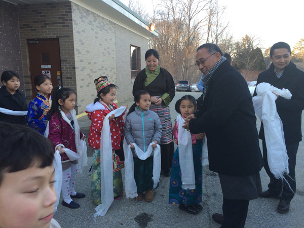 Education Kalon greeting schoolchildren during a visit to the Tibetan community in the US