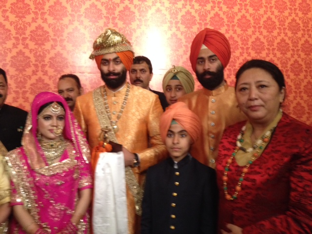 Kalon Dolma Gyari with the groom at the wedding reception.