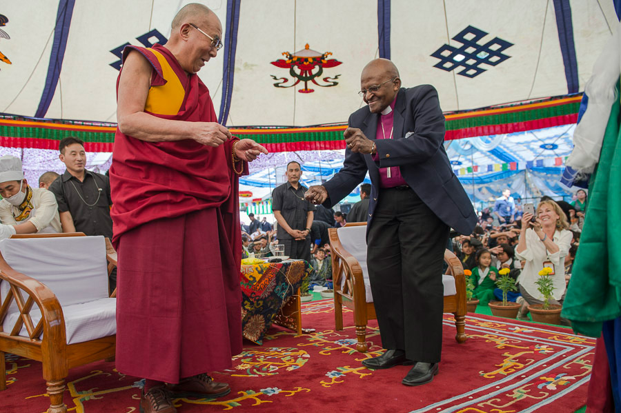 Archbishop Desmond Tutu dancing to all the children singing 'We are the World' during his visit with His Holiness the Dalai Lama to Tibetan Children's Village School (TCV) in Upper Dharamsala, HP, India on April 23, 2015. Photo/Tenzin Choejor/OHHDL