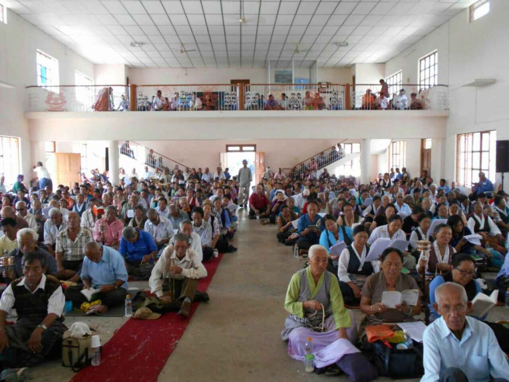 Residents of Bylakuppe Tibetan settlement at the prayer service for Nepal earthquake victims.