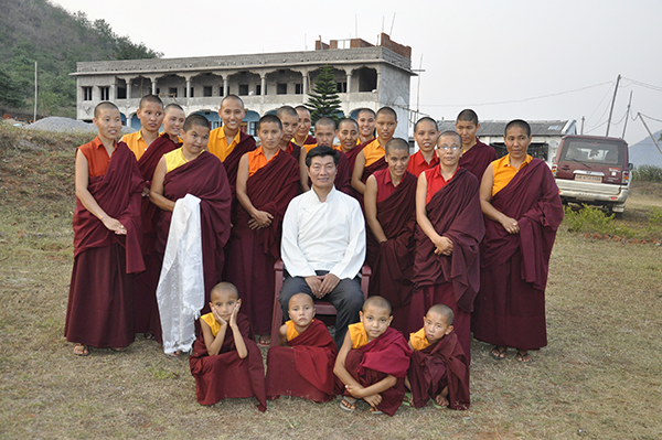 Sikyong poses with a group of tibetan Buddhist nuns in Phuntsokling Tibetan Settlement, Odisha.