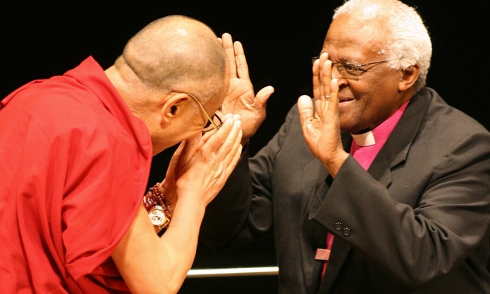 Deep dialogue’ ... Desmond Tutu welcomes the Dalai Lama to the international peace conference in Hiroshima in 2006. Photograph: Kazuhiro Nogi/AFP/Getty Images