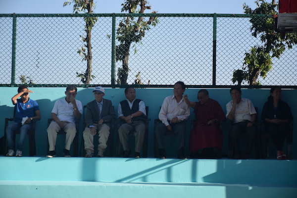 Secretaries of various departments watching the exhibition match being played to mark the inaugural.