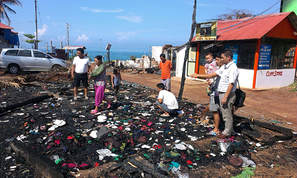Mr. Karma Singe, the Chief Representative Officer of Southern Tibetan Settlements, at the site destroyed by fire in Varkala, Kerala.