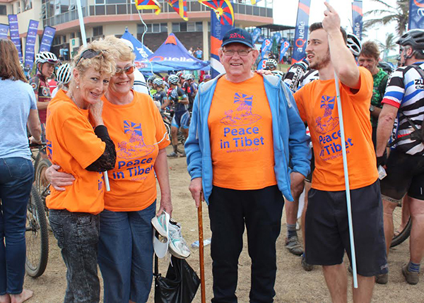 Tibet supporters wearing shirts with the words ' Peace in Tibet' at the race.