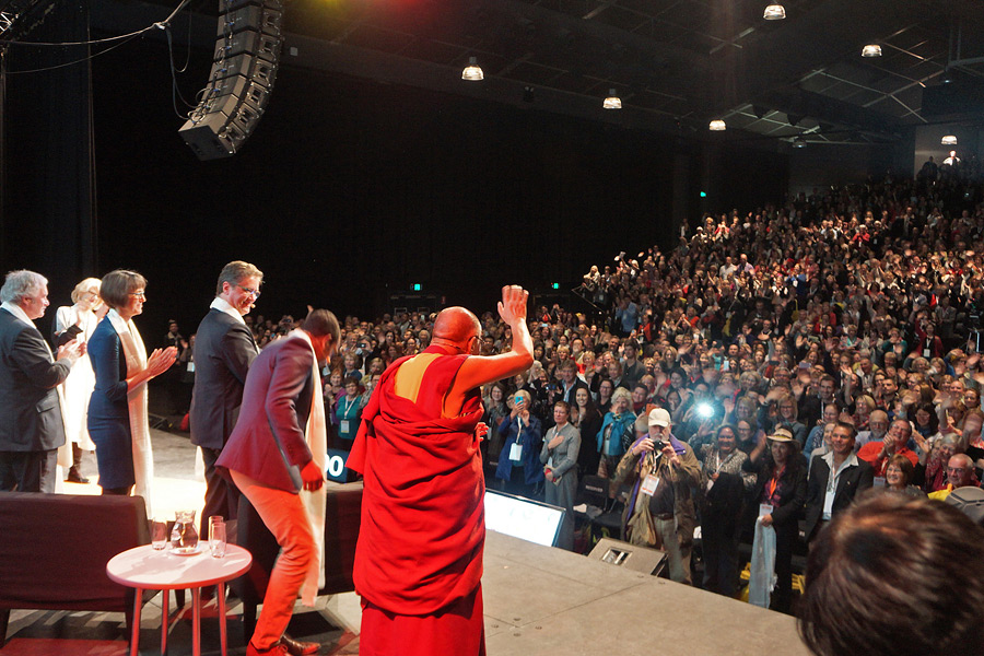 His Holiness the Dalai Lama waving to the audience at the end of the opening session of the conference on Happiness & It's Causes conference at Luna Park in Sydney, Australia on June 10, 2015. Photo/Jeremy Russell/OHHDL