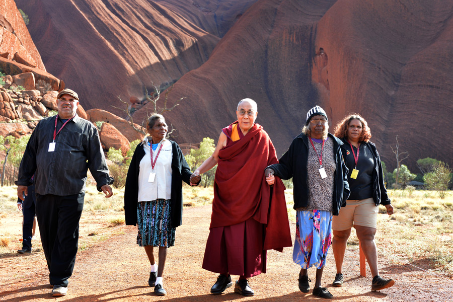 His Holiness the Dalai Lama, along with his hosts, returning from his walk through Uluru-Kata Tjuta National Park in Uluru, Northern Territory, Australia on June 13, 2015. Photo/Rusty Stewart