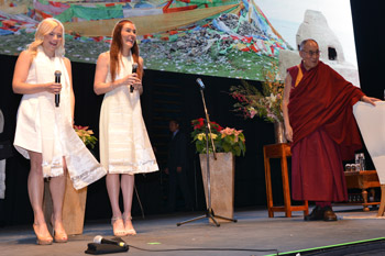 Suzie Mather and Jemma Rix singing Happy Birthday to His Holiness the Dalai Lama at the conclusion of his talk in Perth, WA, Australia on June 14, 2015. Photo/Rusty Stewart