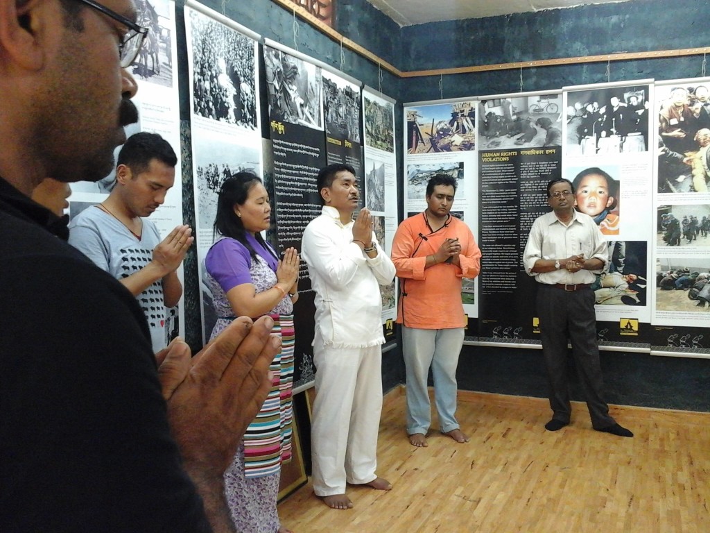Organising members and Visitors reciting prayers for