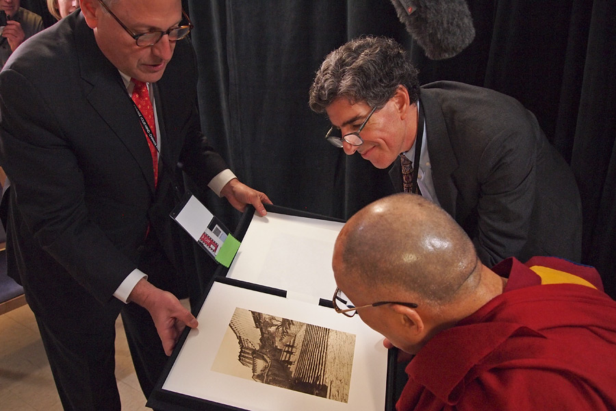 Gary Nell of National Geographic presenting His Holiness the Dalai Lama photographs of Tibet from the magazine's archive before their interview in Madison, WI, USA on March 9, 2016. Photo/Jeremy Russell/OHHDL