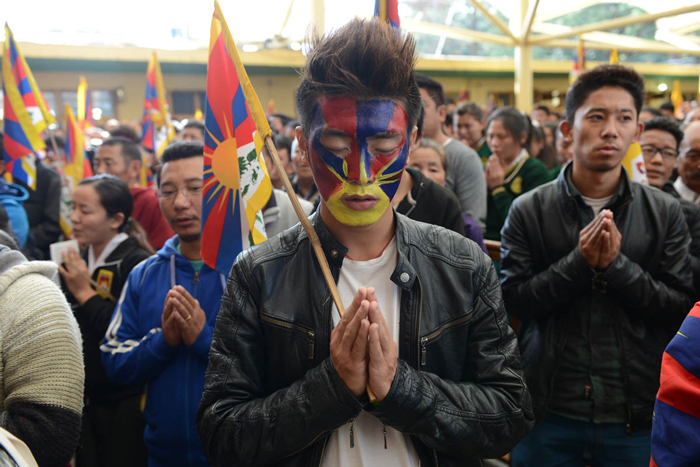 Exile Tibetans pray as they mark the 57th anniversary of the 1959 uprising against Chinese rule in McLeod Ganj on 10 March 2016.