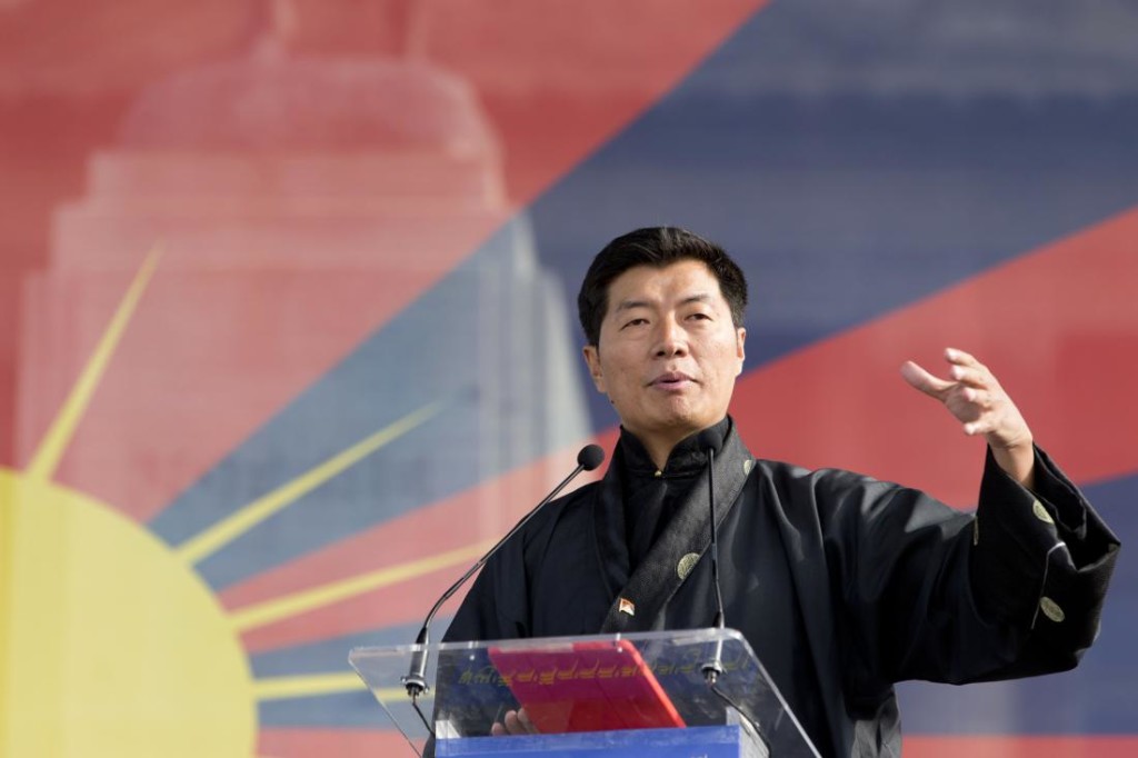 Lobsang Sangay, Sikyong (prime minister) of the Tibetan Government-in-Exile,  delivers a speech during a European rally marking a failed 1959 uprising against China on March 14, 2015 in Paris. That uprising forced the Dalai Lama to flee, and the Tibetan spiritual leader has been living in exile in India ever since. Both the Dalai Lama and the leader of Tibet's exiled government Lobsang Sangay advocate greater autonomy for the Tibetan region within China, but Beijing accuses them of being separatists and wanting flat-out independence. AFP PHOTO / KENZO TRIBOUILLARD        (Photo credit should read KENZO TRIBOUILLARD/AFP/Getty Images)