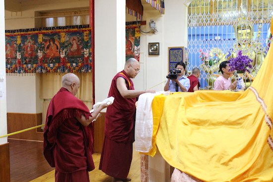 Speaker Khenpo Sonam Tenphel offering ceremonial Tibetan scarves to partrait of His Holiness the Dalai Lama, 31 May 2016.