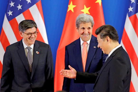 Chinese President Xi Jinping, right, meets with U.S. Secretary of State John Kerry, center, and Treasury Secretary Jack Lew. © Reuters