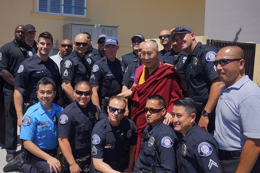 His Holiness the Dalai Lama with some of the local law enforcement officers who helped during the Opening Ceremonies of the Vietnamese Dieu Ngu Buddhist Temple in Westminster, California on June 19, 2016. Photo/Jeremy Russell/OHHDL