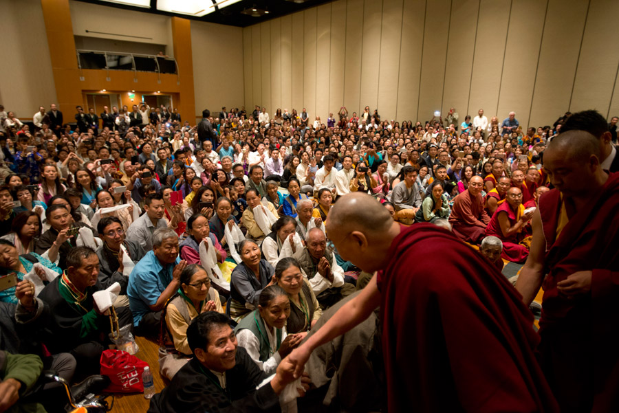 His Holiness the Dalai Lama greeting members of the Tibetan community at the start of their meeting at his hotel in Anaheim, California on June 19, 2016. Photo/Don Farber