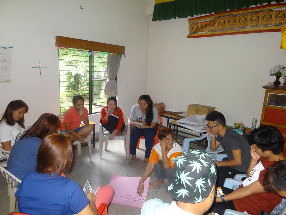 Trainees actively participating in group discussion.