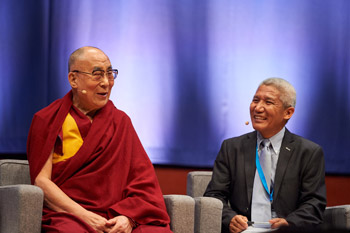 Dr Thubten Jimpa, His Holiness the Dalai Lama's interpreter, looks on as His Holiness comments on the presentations at the Mind & Life Dialogue at the Bozar Centre in Brussels, Belgium on September 9, 2016. Photo/Olivier Adam