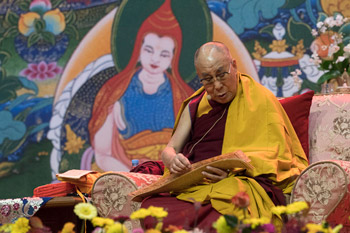 His Holiness the Dalai Lama reading from the text during his teaching in Riga, Latvia on October 11, 2016. Photo/Tenzin Choejor/OHHDL
