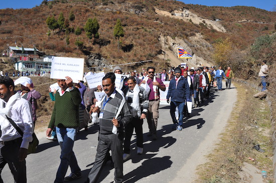 The participants of the Tawang yatra holding a peace procession from Tawang monastery to Kalawangpo Convention Center.
