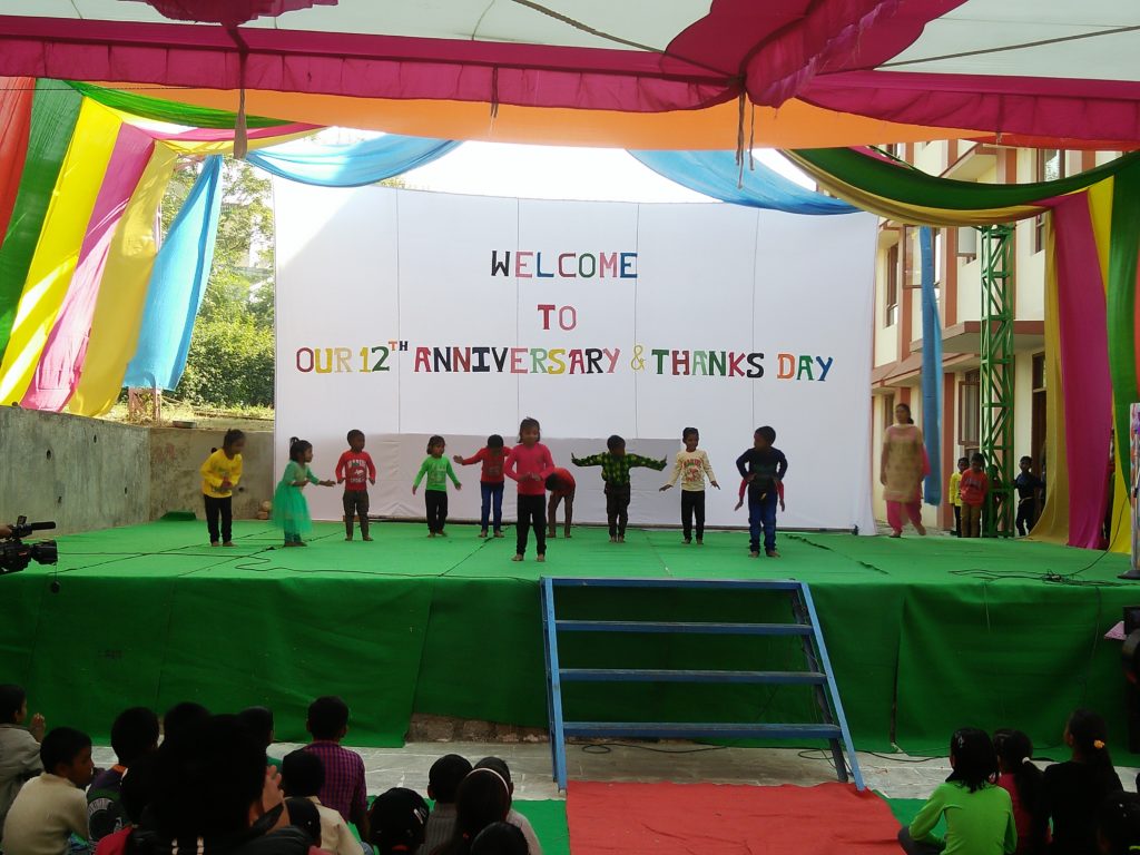 indian school children performing Hindi songs during the anniversary function.