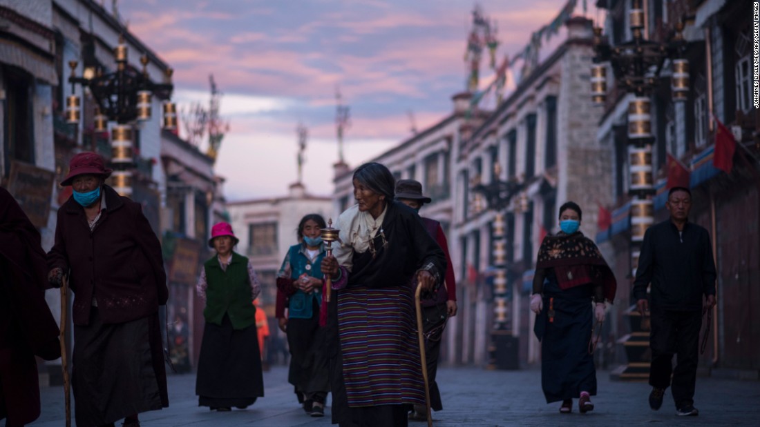 Pilgrims walking and praying near the Jokhang Temple in Lhasa, in September.