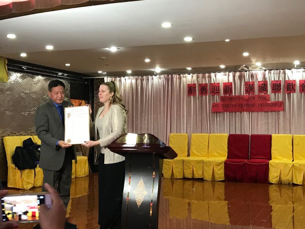 Representative Mr Penpa Tsering being presented an honorary memento from the office of Mr Rubin Diaz, member of New York City council.