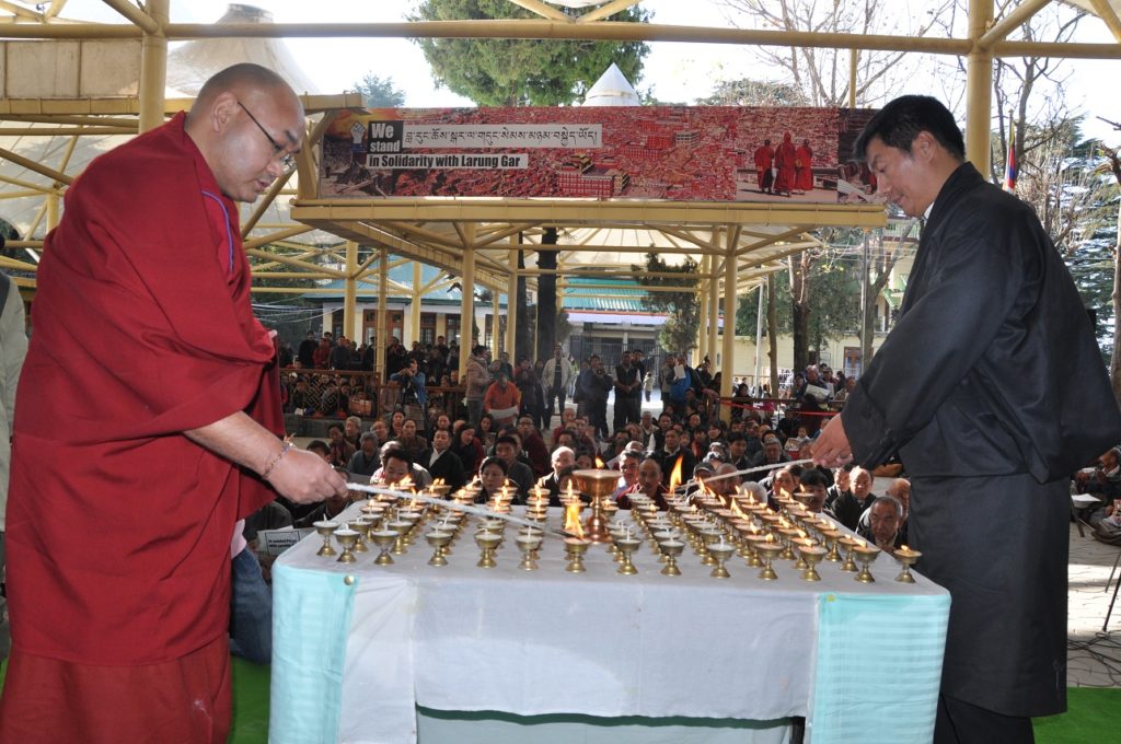 Sikyong Dr Lobsang Sangay and Speaker Khenpo SOnam Tenphel lighting butter lamps in memory of the Tibetan self-immolaters at Tsuglagkhang on 10 December 2016.