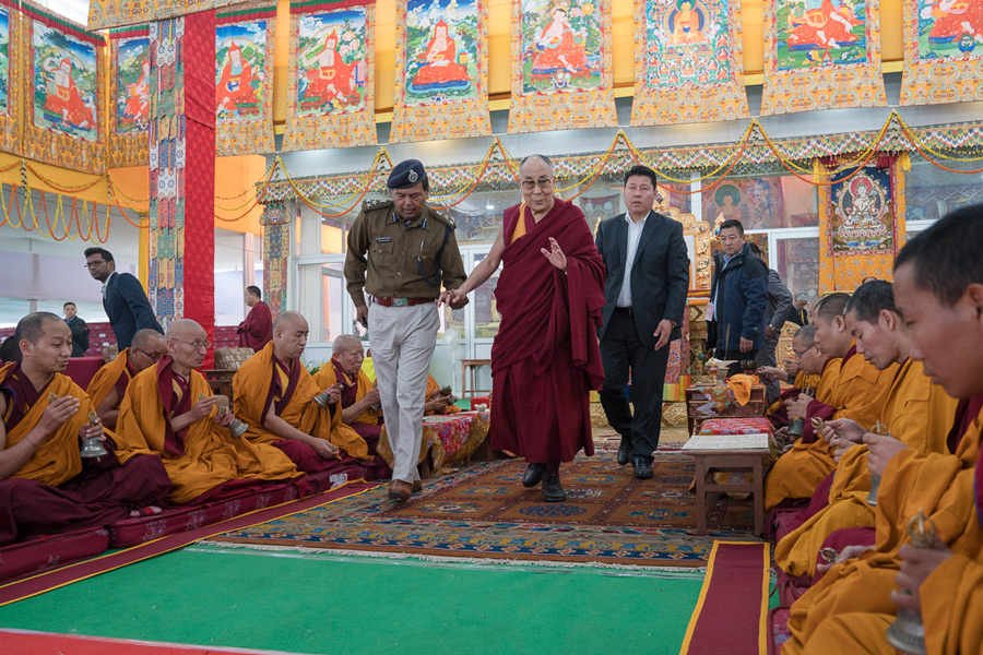 His Holiness the Dalai Lama greeting monks from Namgyal Monastery reciting prayers as he departs the Kalachakra teaching ground in Bodhgaya, Bihar, India on January 15, 2017. Photo/Tenzin Choejor/OHHDL