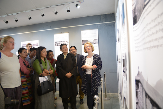 Dr Emma Martin explaining the exhibits to Secretary Sonam Norbu Dagpo and other guests, 14 April 2017.