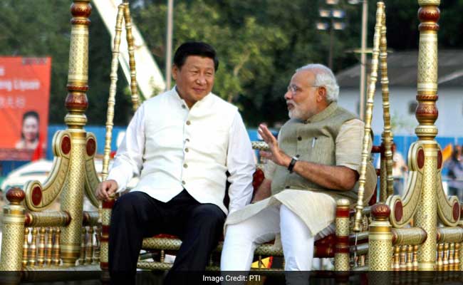 PM Narendra Modi and Chinese President Xi Jinping sit on a traditional swing at the Sabarmati riverfront