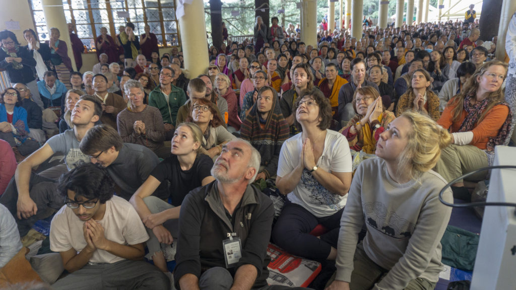 Devotees looking at the screening of His Holiness teaching. Photo/Tenzin Jigme/CTA