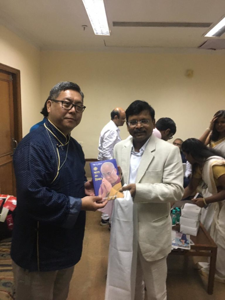 ITCO Coordinator Mr. Jigmey Tsultrim presenting a book to Dr. Harshadeep Kamble (IAS) organizer of Bhimanjali 2019. Photo/ITCO