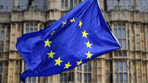 The European Union flag waving in the air.
